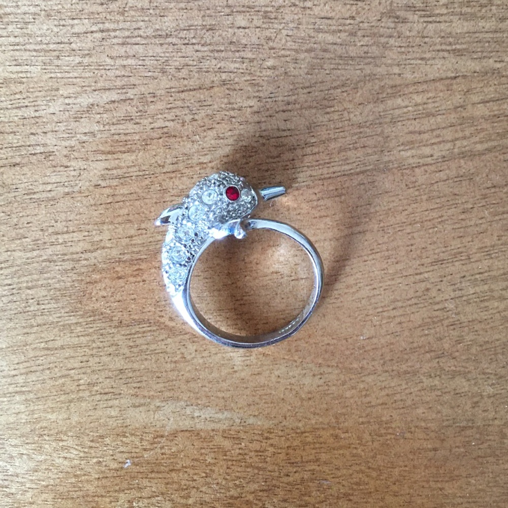 Silver bejeweled dolphin ring